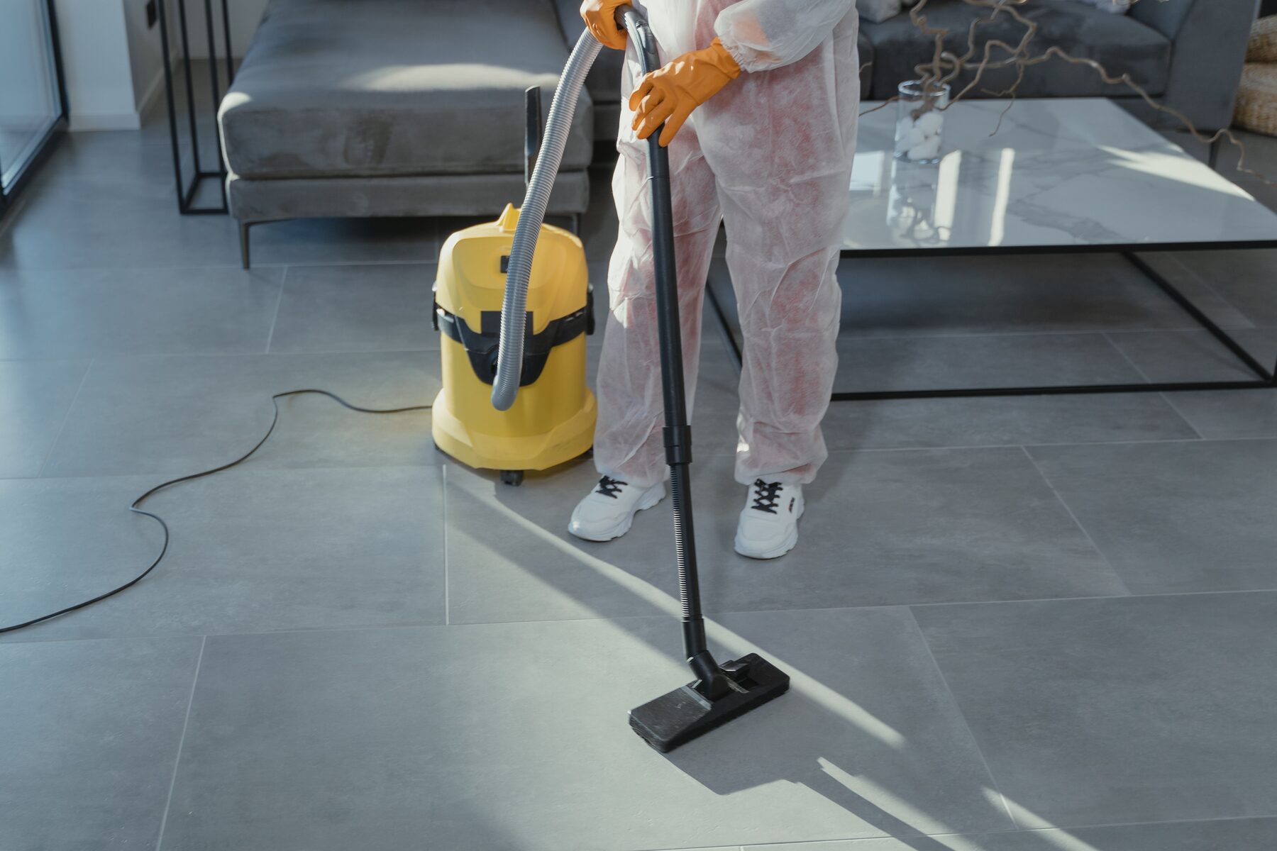 Samson cleaning technician vacuuming a floor