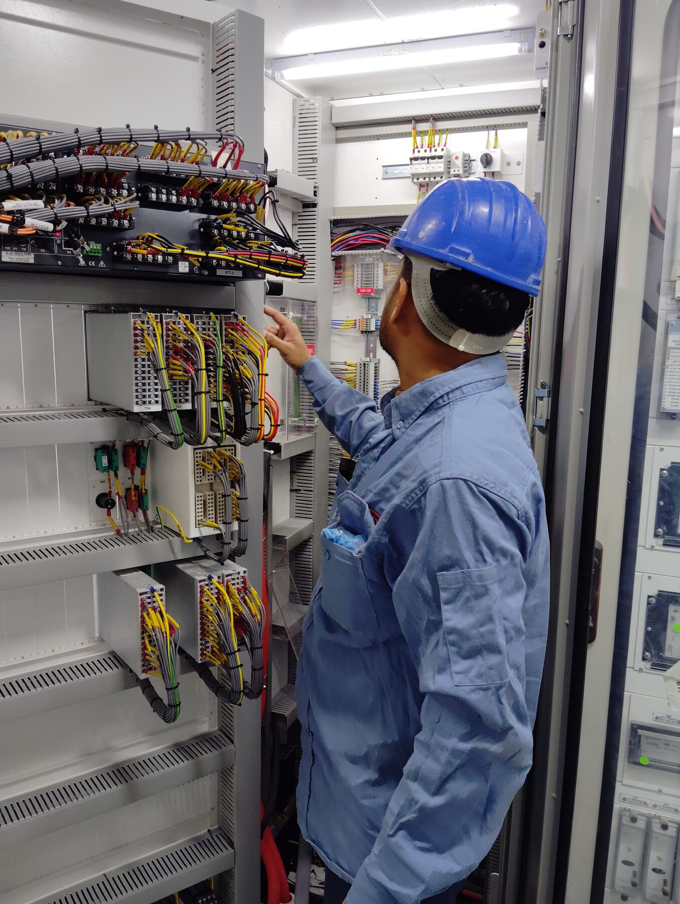 Samson technician servicing an electrical panel